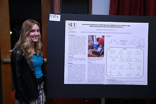 Hailee Holt standing with her reserach poster.