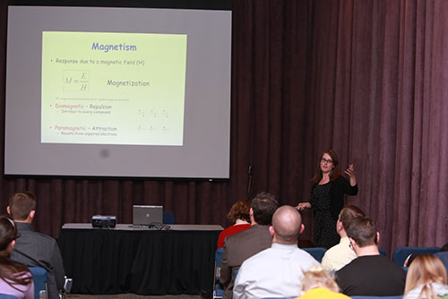 Amber McConnell presenting her research to an audience.