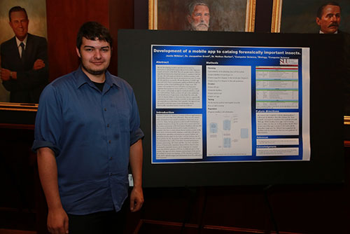 Justin Wilkins with his research poster.