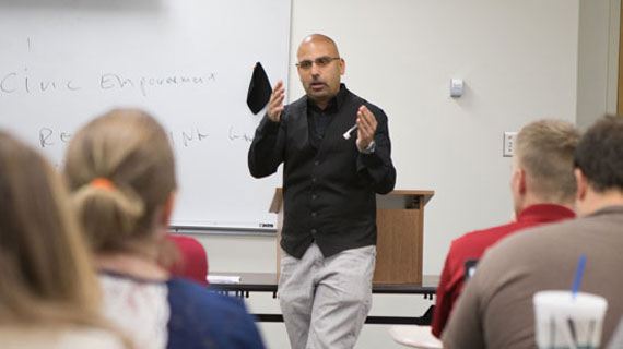 Dr. Ravi Roy leading a discussion
