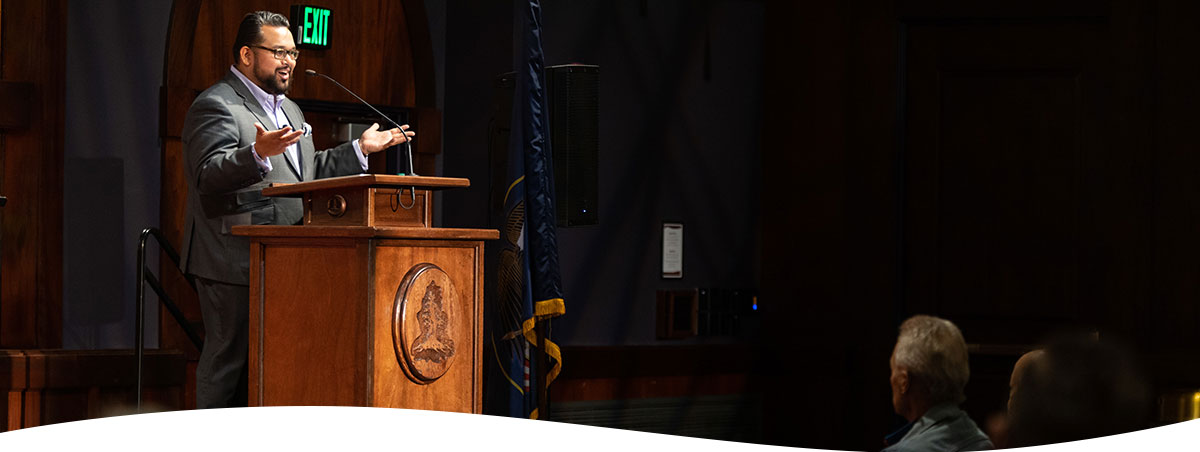 Man Speaking at Podium in SUU's Great Hall