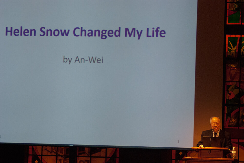 An-Wei in front of a slide that says: "Helen Snow Changed My Life" 8