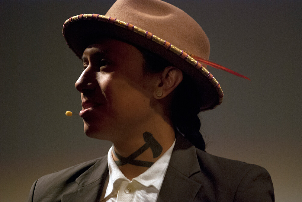 Man with a fedora and tattoo on his neck. 5