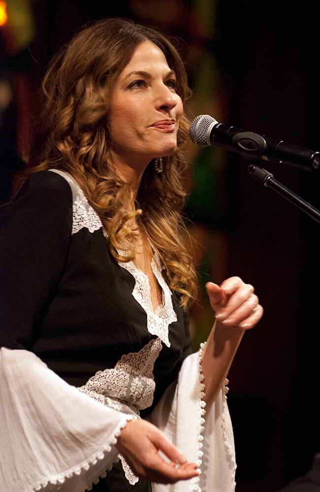 Loire Cotler in front of a microphone 3