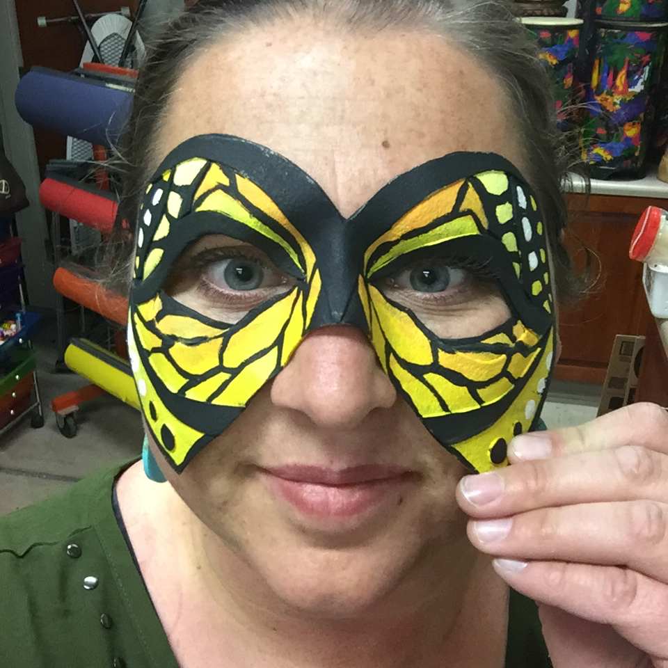 Woman with Butterfly face mask on 