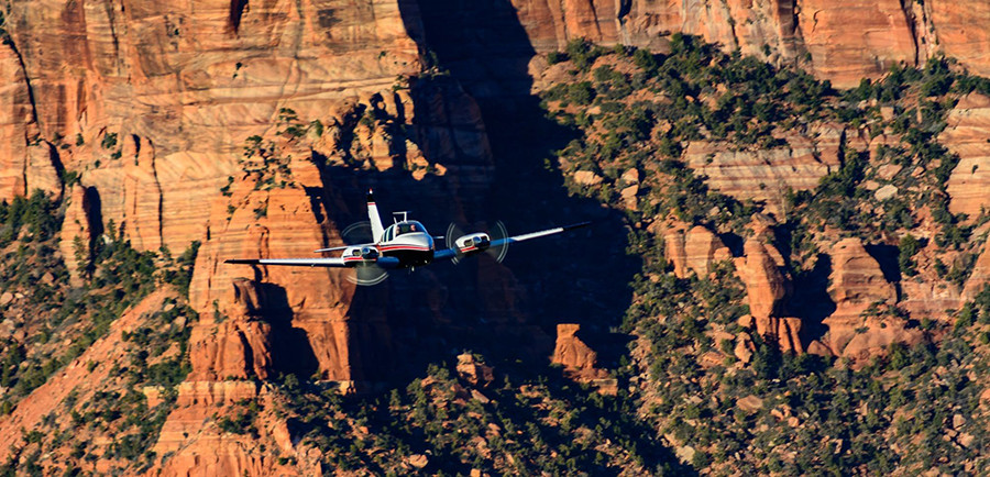 Picture of Baron multi-engine aircraft flying over kolob canyon