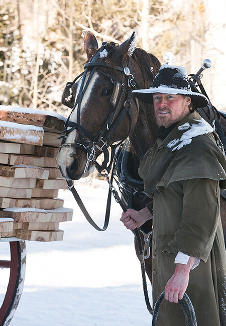 Jasen Wade as Neil Bladen standing with his horse