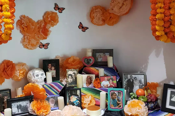 Community Ofrenda with photos of loved ones