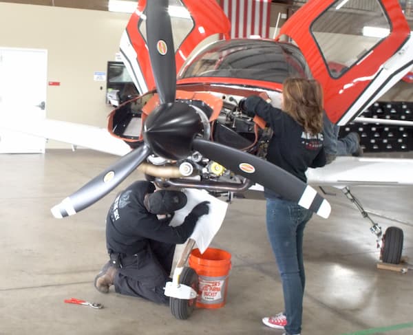 SUU Students doing maintenance aircraft
