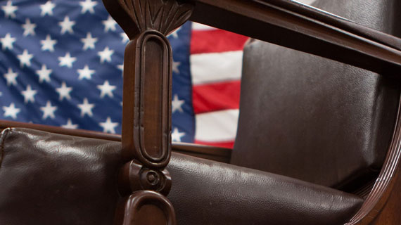 Leather chair with american flag in background