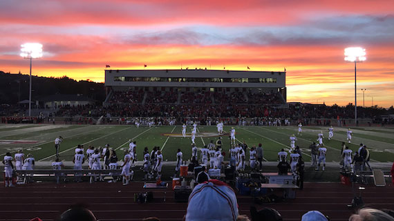 football game at sunset