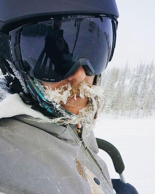 person with frozen beard in a ski mask