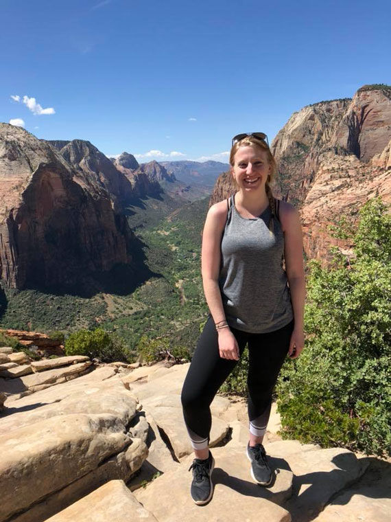 student in front of zion park