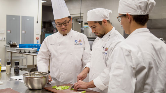 Hotel chefs preparing meal