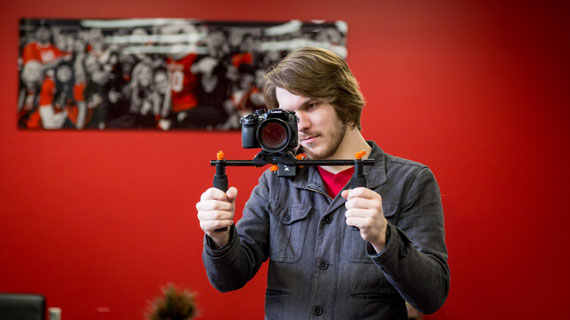 Student holding camera on glidecam