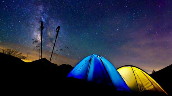 two tents pictured under the stars