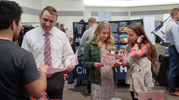 Students at a Career Fair speaking potential employers