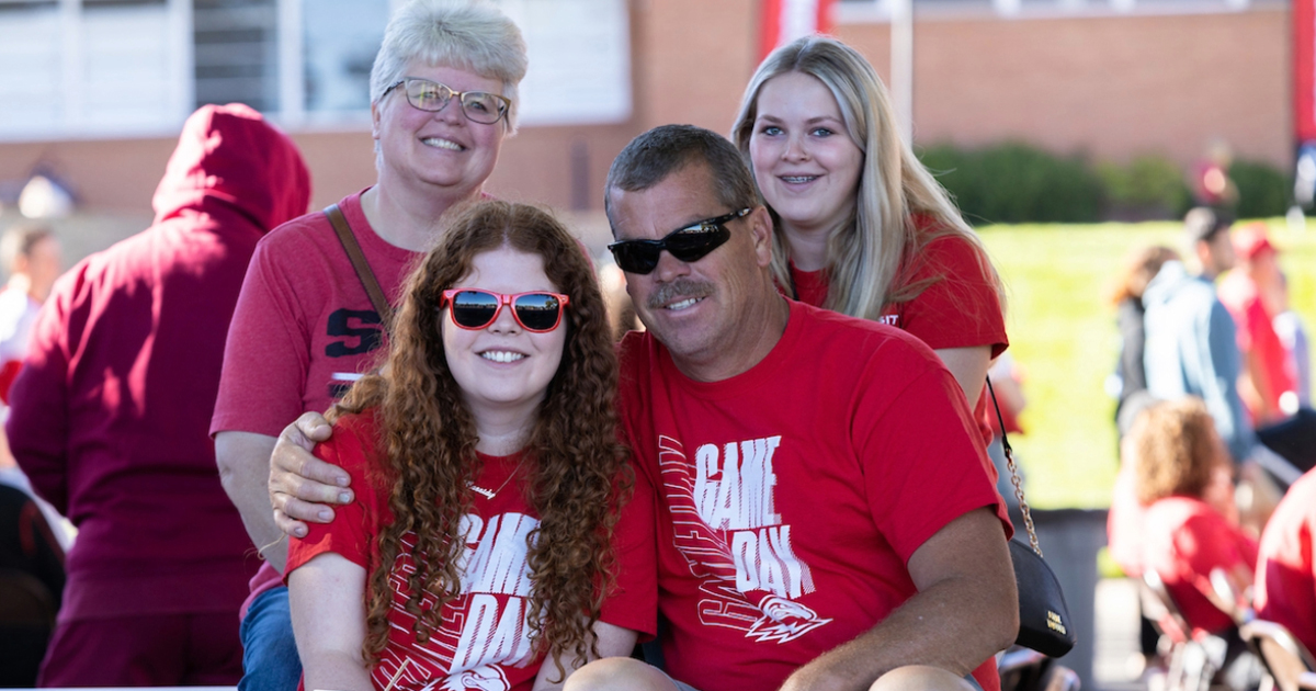 family in red shirts at suu homecoming event