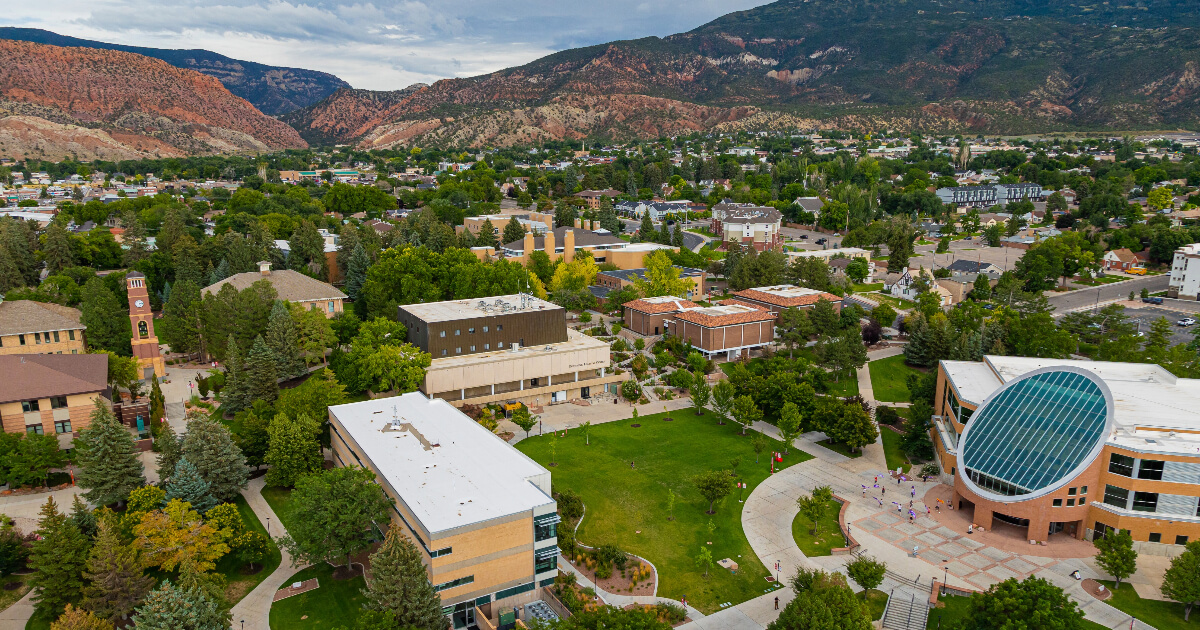 Campus aerials featuring the Gerald R. Sherratt Library and the Bell Tower. 