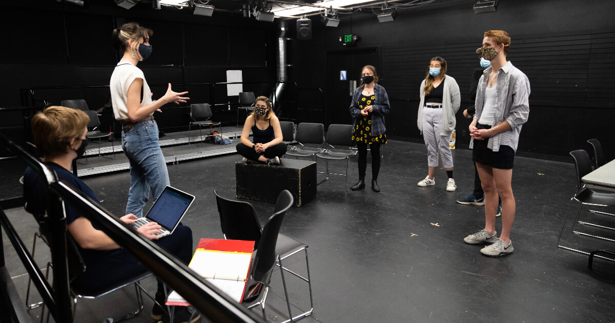Students in a theatre for a 2nd studio production rehearsal