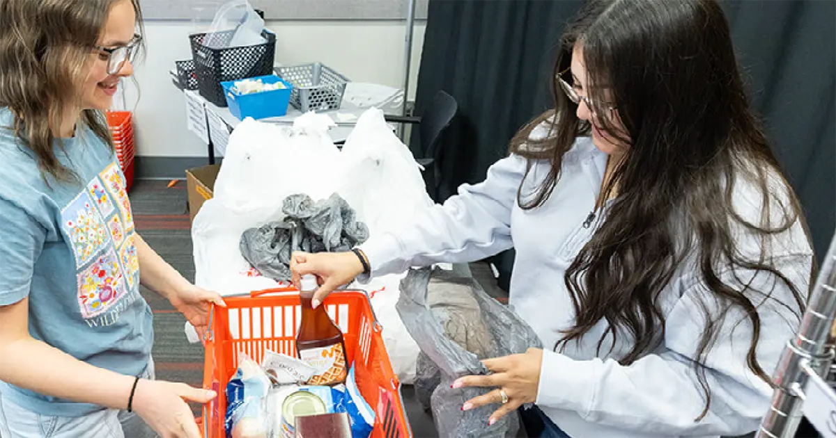 An SUU Student picking up food from the HOPE pantry.