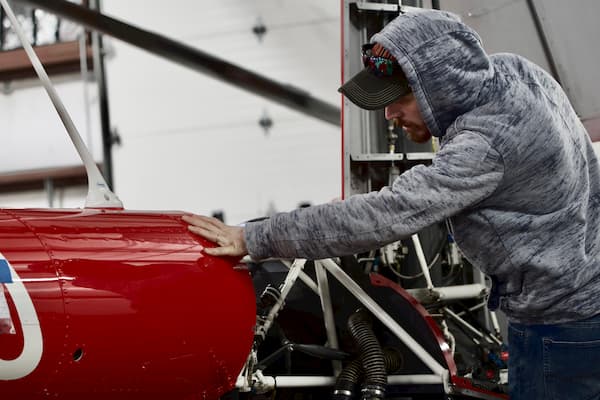 SUU Aviation Technician student working on the engine