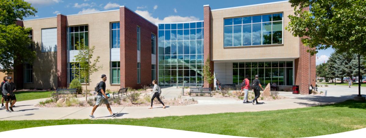 Students walking in front of business building at SUU