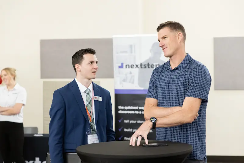 Two men discussing at a table 33