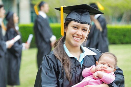 SUU Graduate holding a baby