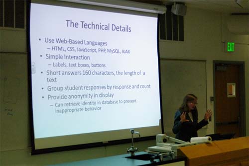 Cecily Heiner in front of a class presenting her research