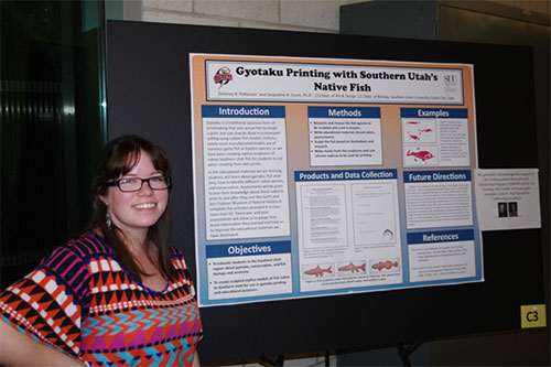Delaney Patterson standing next to her research poster