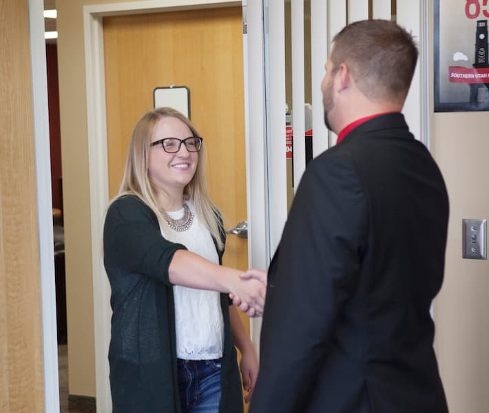 Teacher and administrator shaking hands