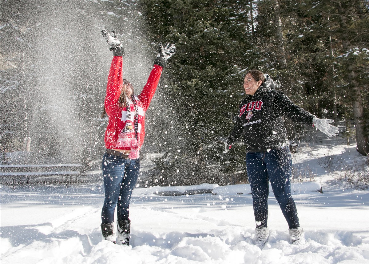 Two students playing in the snow 14