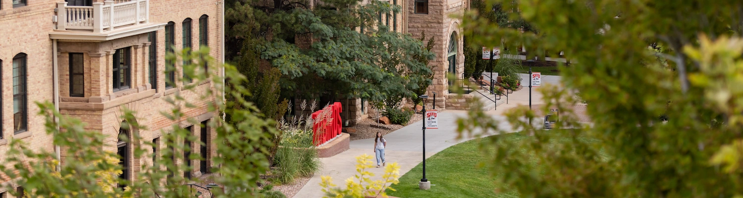 Single person walking the upper campus