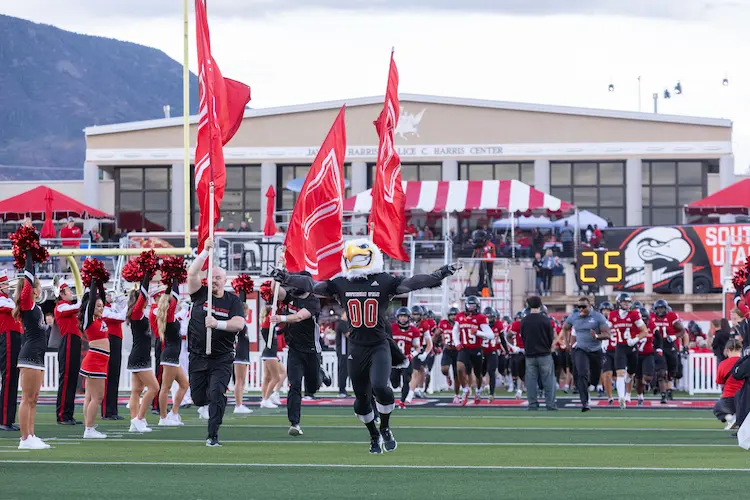 Students Cheering at a Football game.