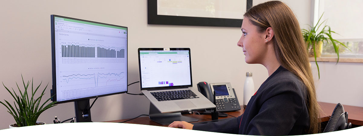 Image of student looking at a computer monitor