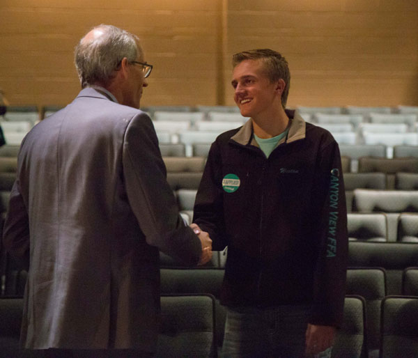 President Wyatt chatting with a student