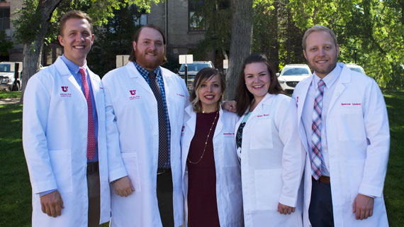 SUU students group picture with their medical white coats
