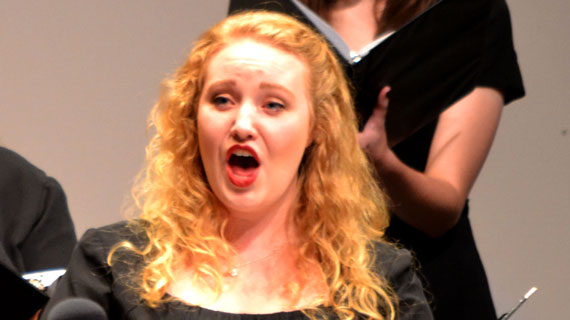 Student Claire Robinson sings in a choir performance.