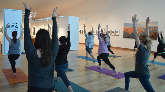 Adults doing yoga in the Southern Utah Museum of Art