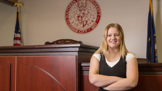 Student Hayley Robertson sitting in SUU's mock courtroom.