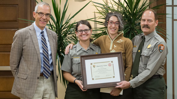 drea pictures with president scott wyatt and national park rangers