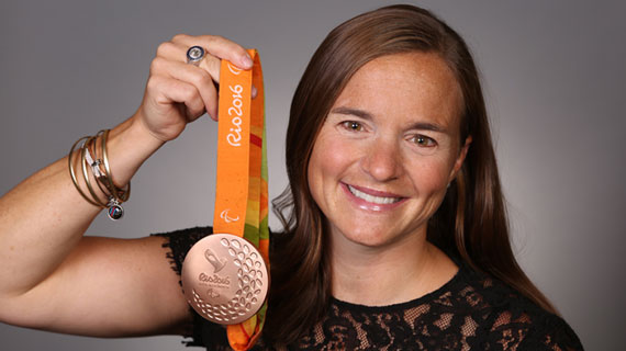 image of Melissa Stockwell holding her Olympic medal