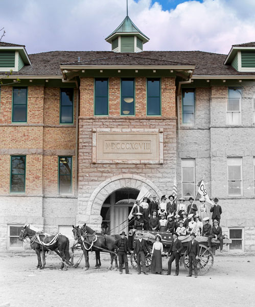 Old image of Old Main and SUU founders blended with a color version of Old Main today