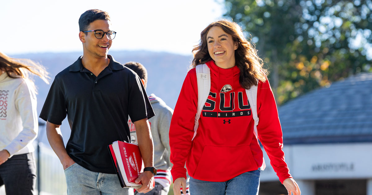 Two students walking on campus