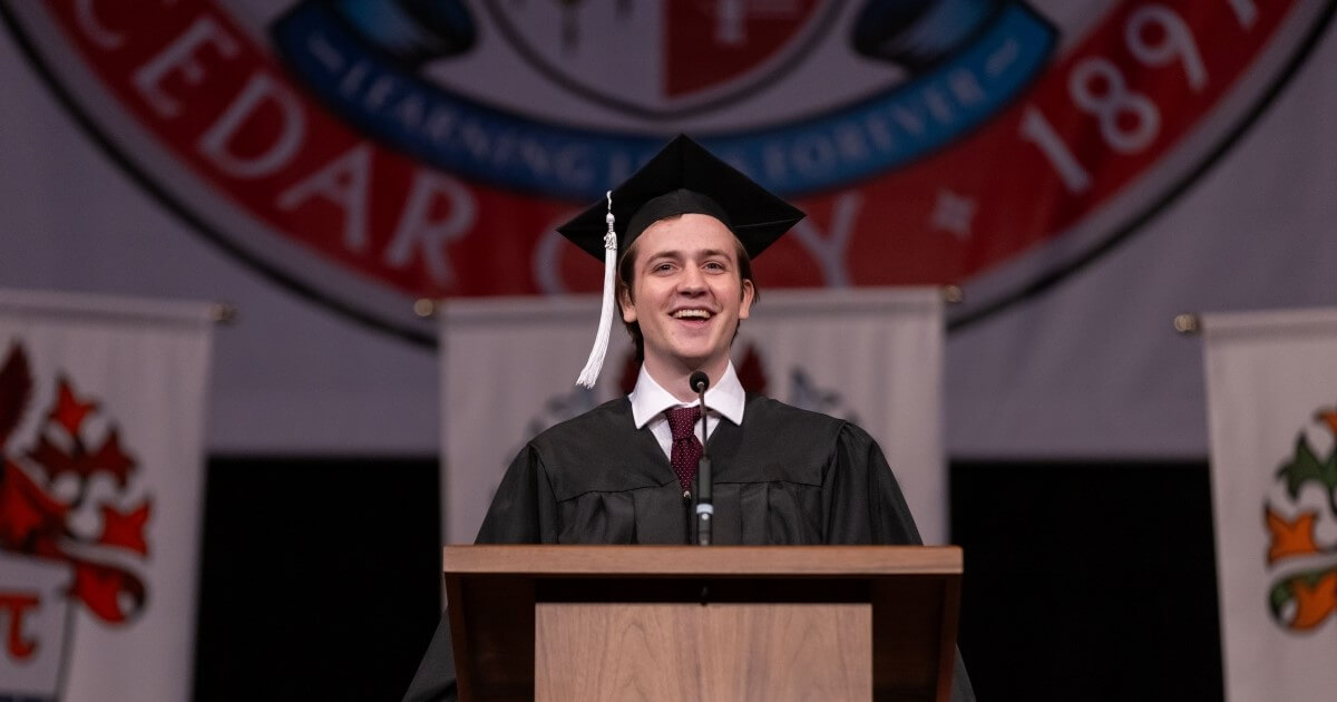Graduating Student Nick Stein at podium