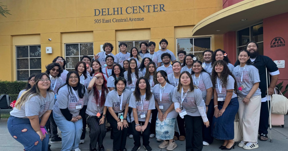 Students pose together outside of the Delhi Center