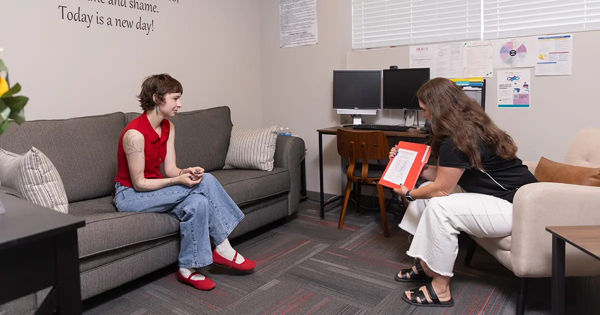 Young woman talking to therapist