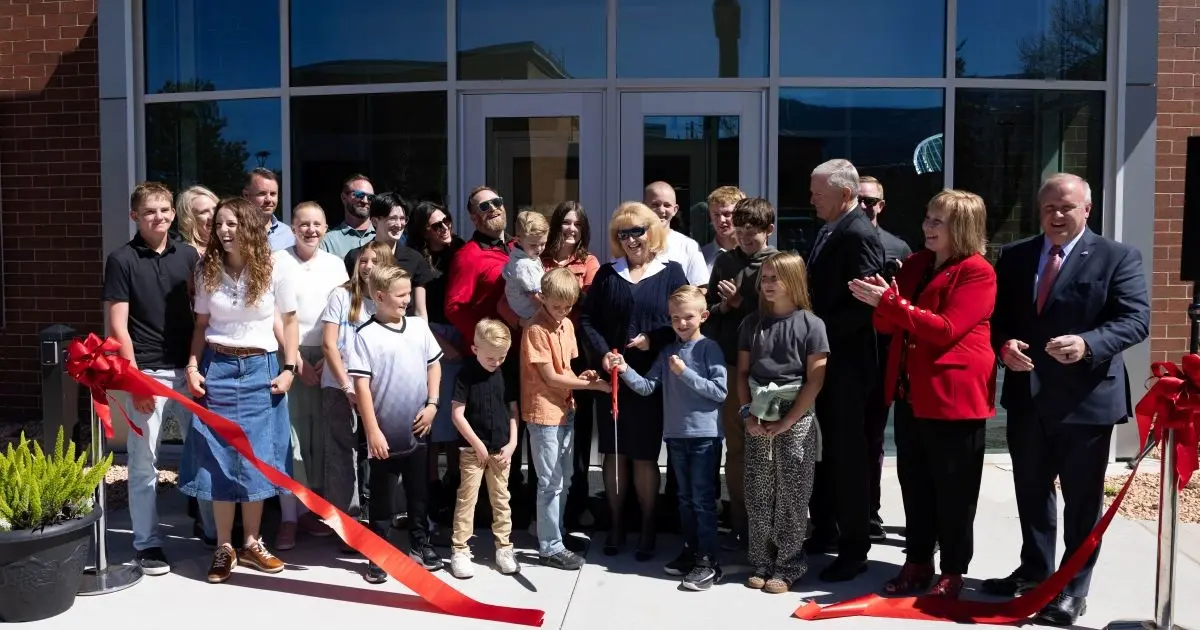 Burgess Family cuts the ribbon at the grand opening