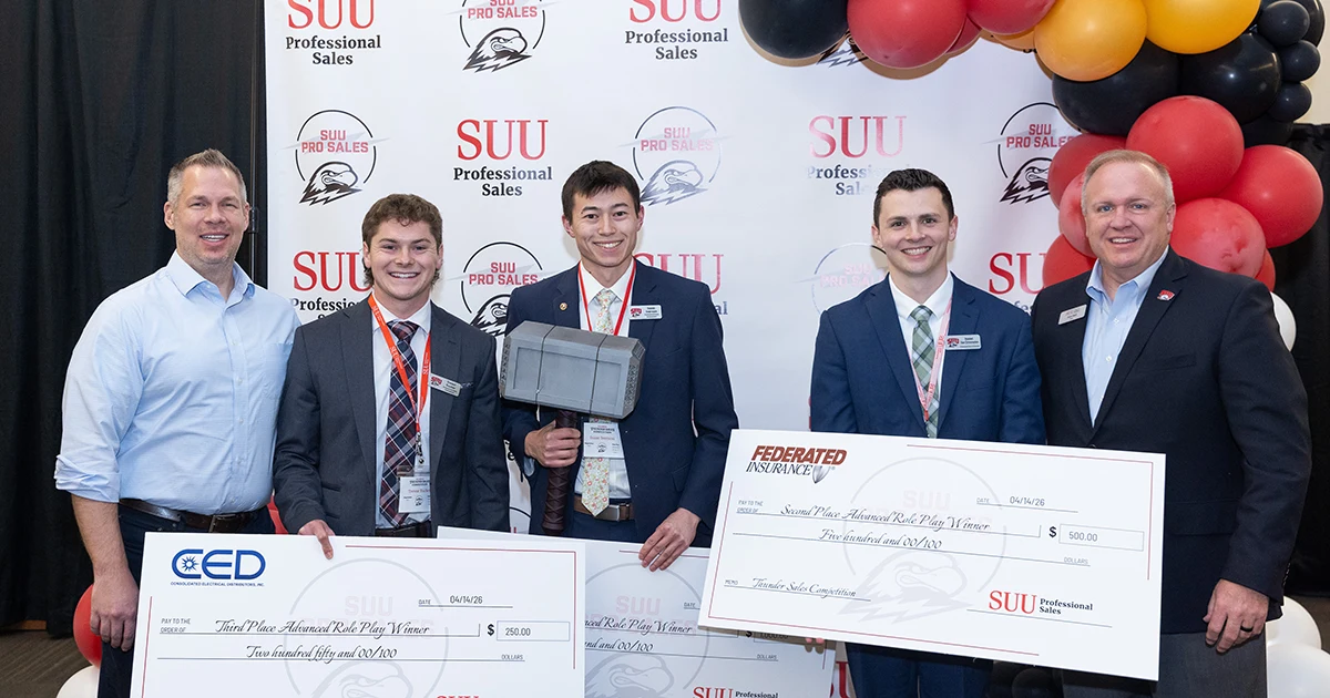 Students posing with their poster awards.